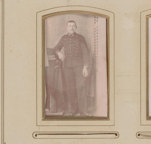 Portrait of a man in uniform with a cigarette in his hand