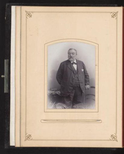 Portrait of a man at a chair