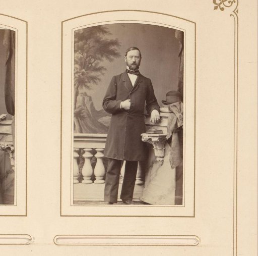Portrait of a man with a hand in his coat