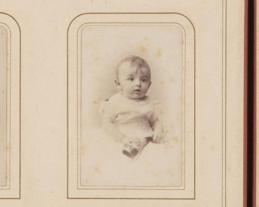 Portrait of a Baby Holding a Horn
