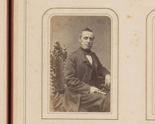 Portrait of a Man at a Table, Holding a Book