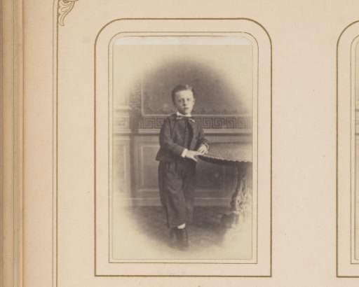 Portrait of a Boy Leaning on a Table