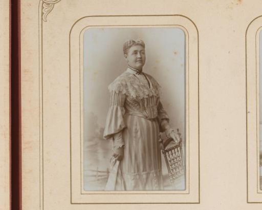 Portrait of a Standing Woman by a Chair