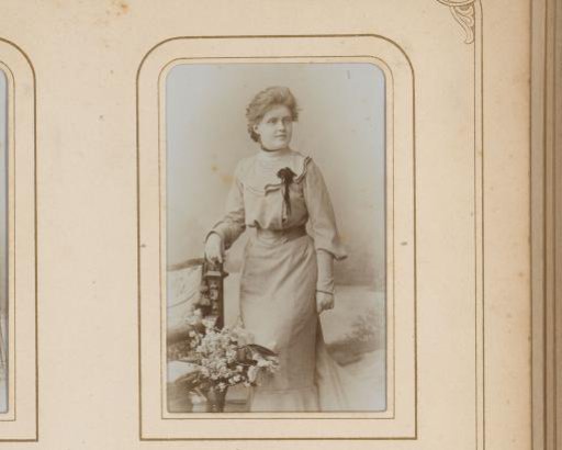Portrait of a Standing Woman by a Chair