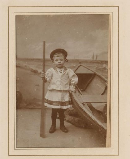 Portrait of a Boy with an Oar in His Hand, Next to a Rowing Boat
