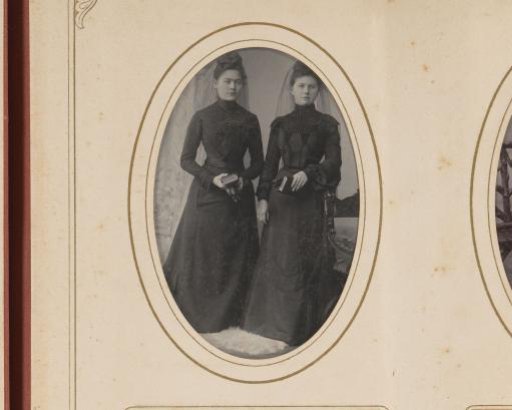 Portrait of two young women in black clothing