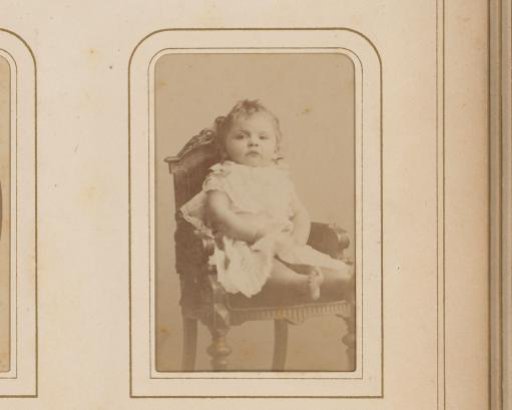 Portrait of a toddler on a chair