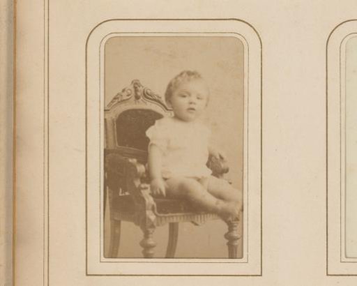 Portrait of a toddler on a chair