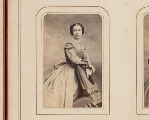 Portrait of a woman leaning on a chair