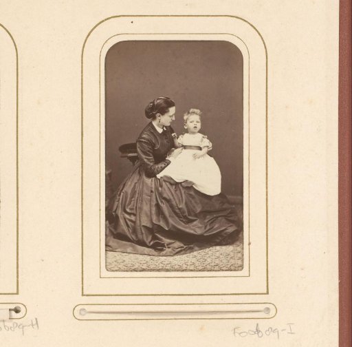 Portrait of a seated woman with child on lap