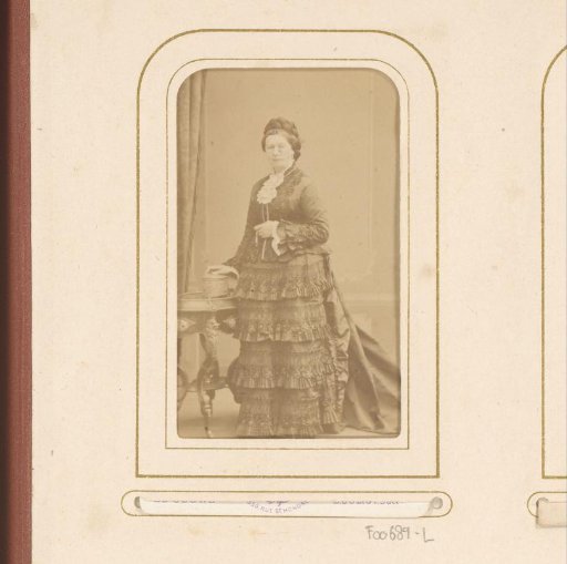 Portrait of a standing woman in a dress