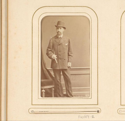 Portrait of a man with a hat and cane