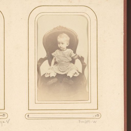 Portrait of a child sitting on a chair