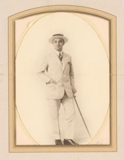 Portrait of a Man in a Suit with a Walking Stick
