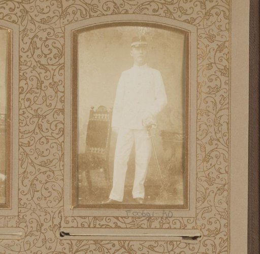 Portrait of a man in white uniform with sabre