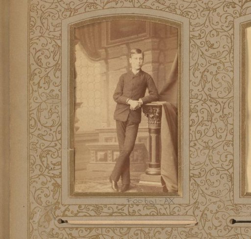 Portrait of a young man by a pillar