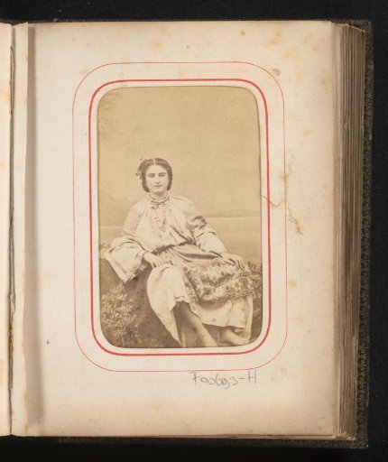 Portrait of a seated woman in Romanian traditional dress