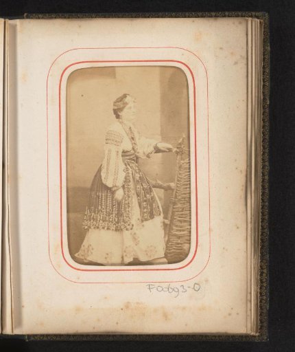 Portrait of a standing woman in Romanian costume