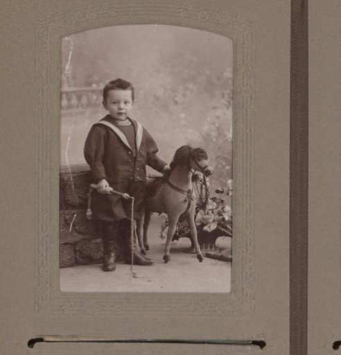 Portrait of a Boy with a Toy Horse