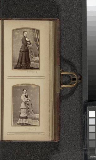 Portrait of a woman standing by an armchair