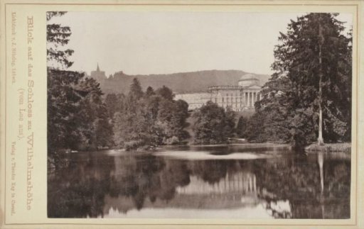 Wilhelmshöhe Castle seen across a lake
