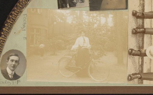 Portrait of a woman with a bicycle in a garden with a child in the background