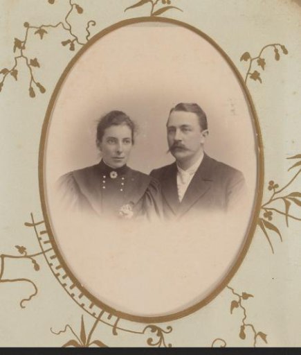 Portrait of a woman and a man with a moustache