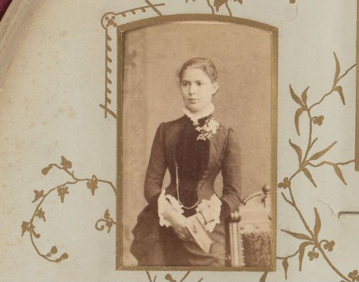 Portrait of a Young Woman Holding a Book