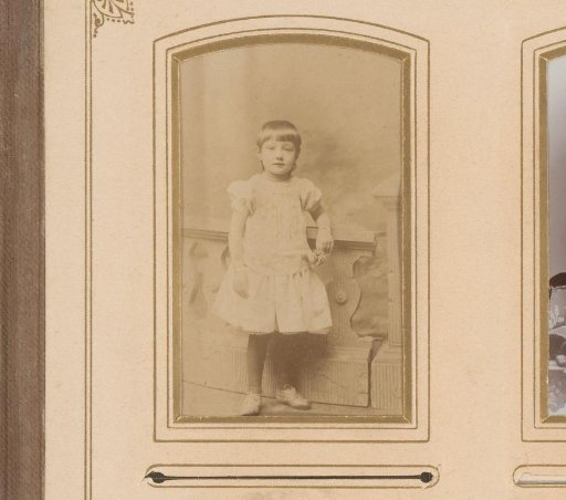 Portrait of a girl, standing by a balustrade