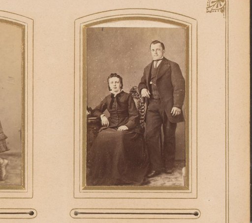 Portrait of a seated woman and a standing man