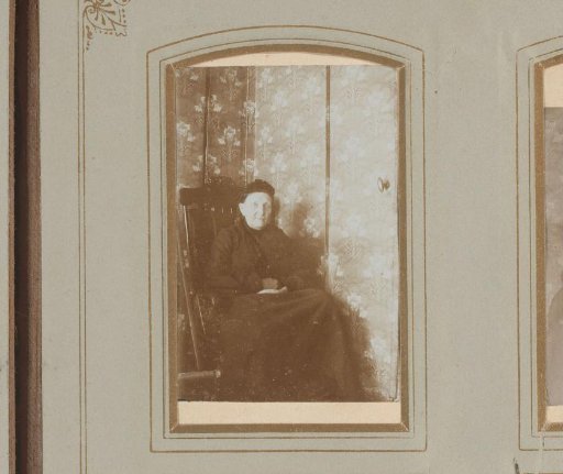 Portrait of an old woman in a chair