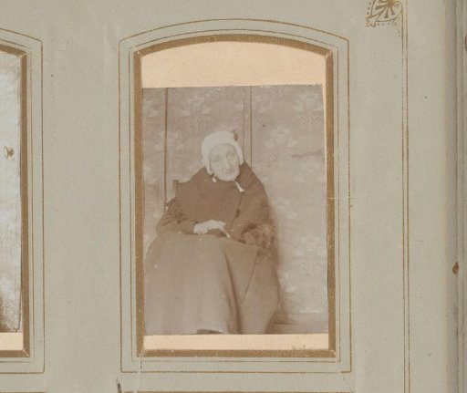 Portrait of an old woman in a chair