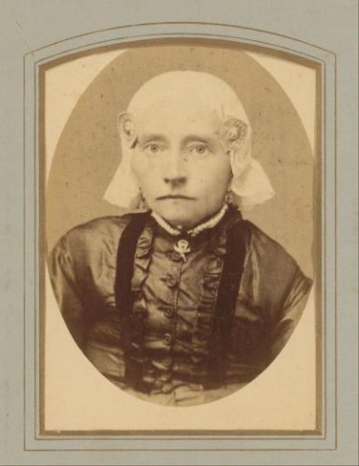 Portrait of a woman with a traditional cap and ear-covers, designated as Jantje Postma