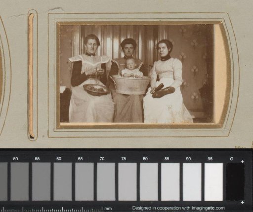 Portrait of Three Women and a Baby in a Tub, One Peeling Potatoes and One Polishing Shoes