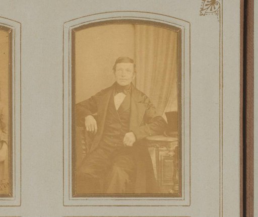 Portrait of a Man Sitting at a Table
