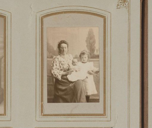 Portrait of a Seated Woman with a Baby on Her Lap and a Standing Girl