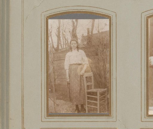 Portrait of a Young Woman Standing in a Garden by a Chair