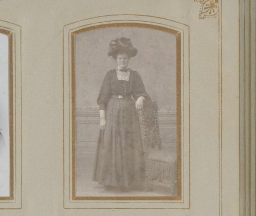 Portrait of a Young Woman with a Hat, Standing by a Chair