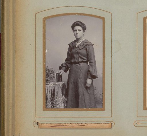 Portrait of a standing woman with a book