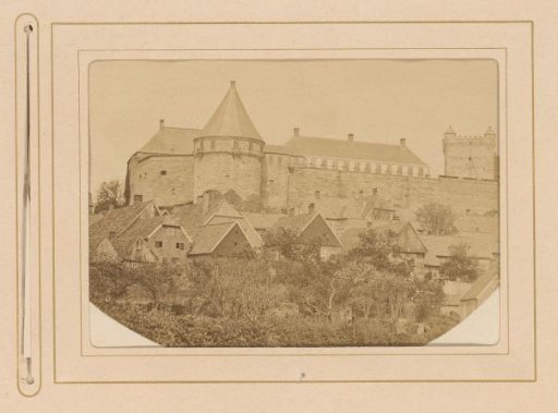 View of a castle with houses against the castle wall