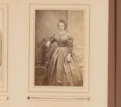 Portrait of a Standing Woman by a Chair