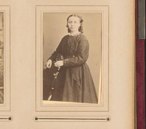 Portrait of a Standing Woman by a Chair