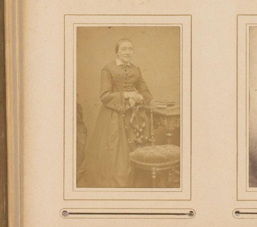 Portrait of an Old Woman by a Chair and Table with Books