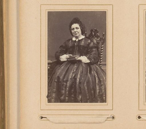Portrait of a Seated Woman with a Cap and a Book