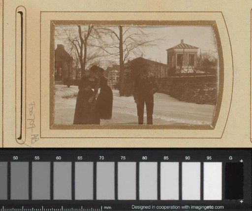 Winter landscape with a man and two women in the snow