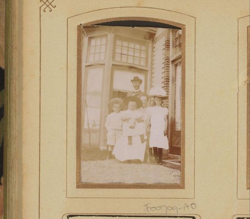 Group portrait of a family, man with wife and three children