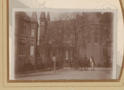 Two women and a man on horseback at the entrance to the Vondelpark in Amsterdam