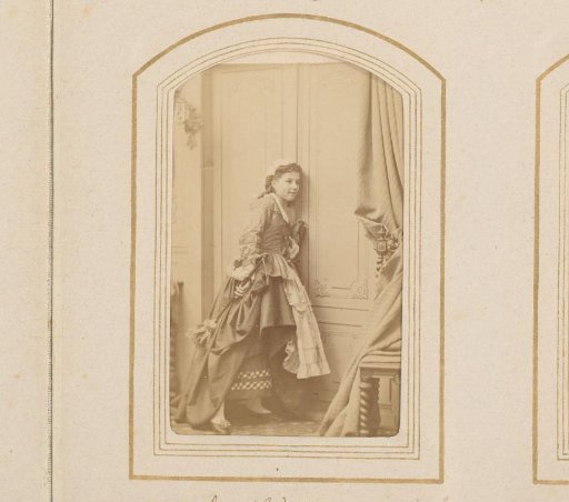 Young woman with a feather duster, listening at closed doors