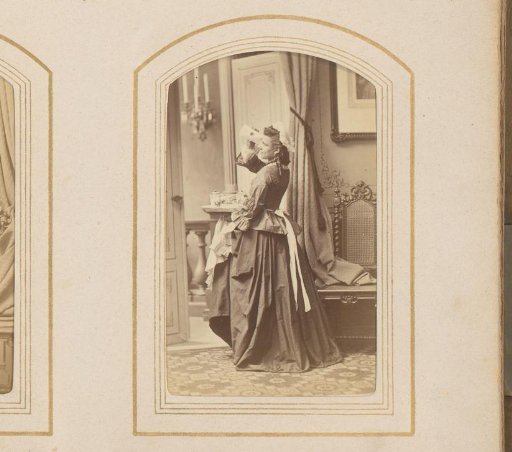 Young woman with a telescope in an interior