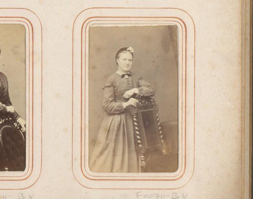 Portrait of a young woman by a chair